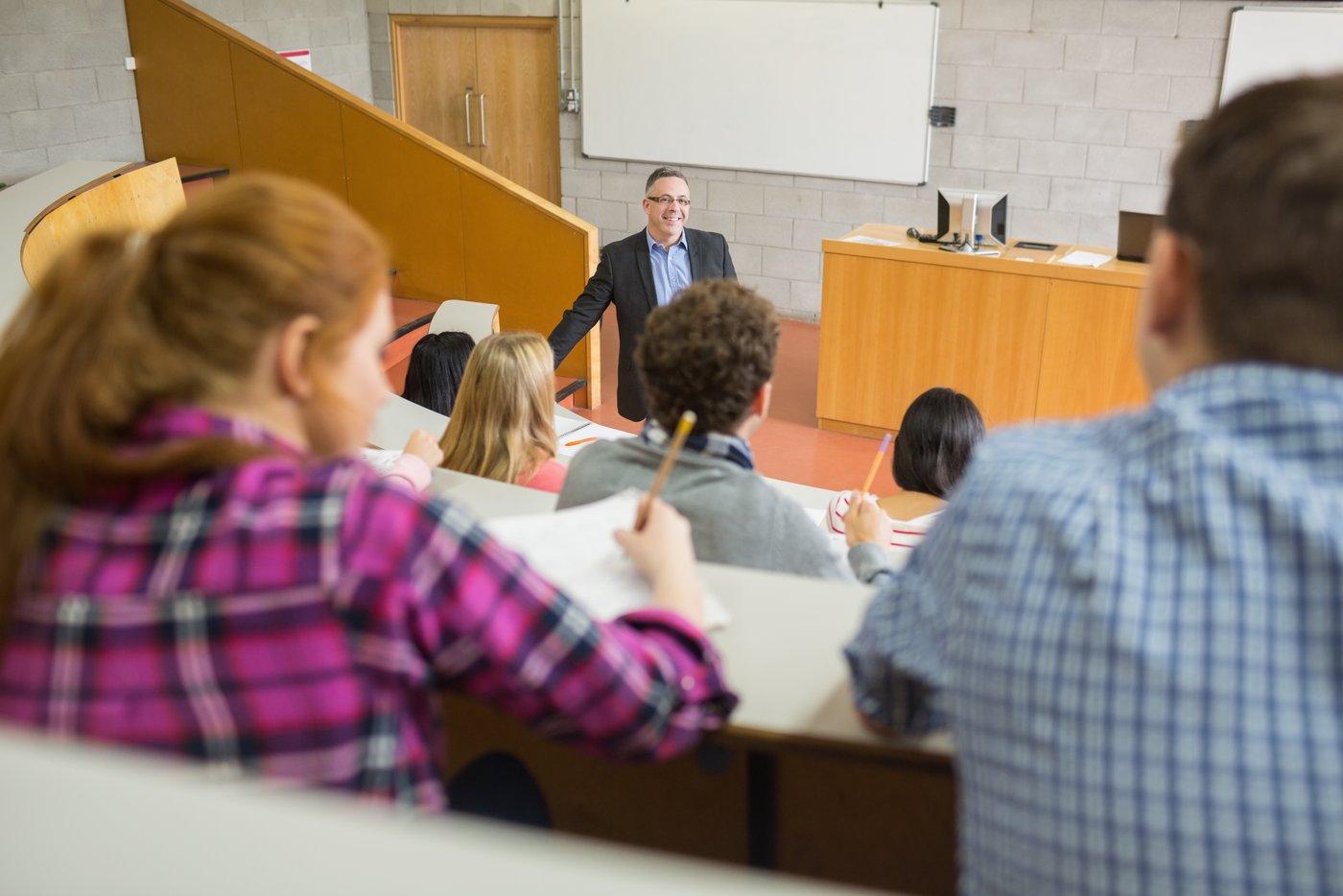 teacher-with-students-lecture-hall.jpg